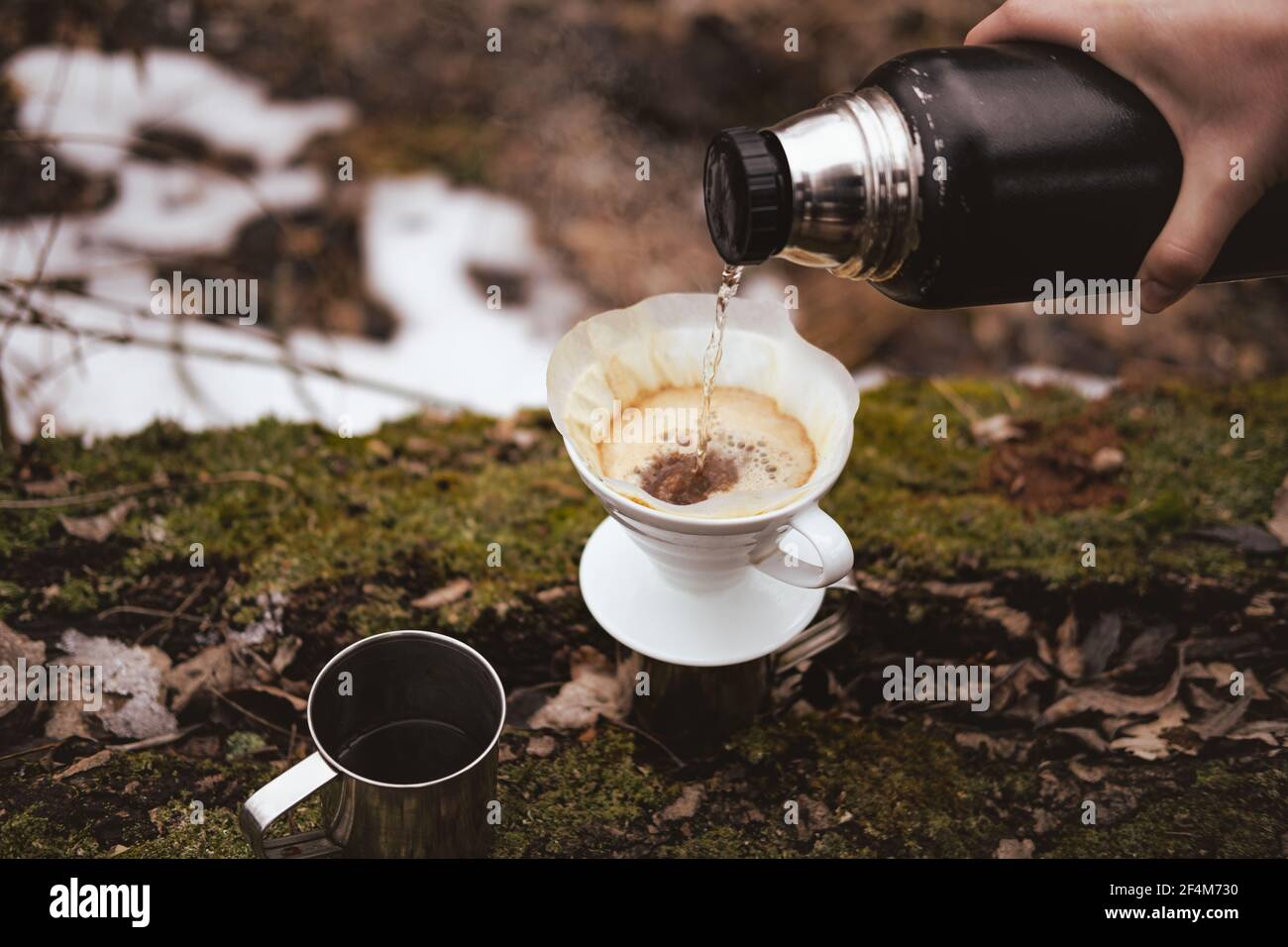 Brewing pour over coffee in nature at a 