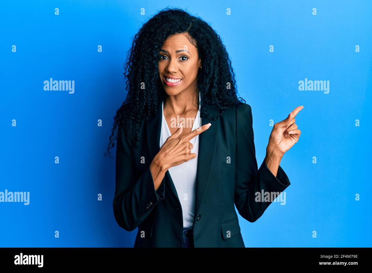 Middle age african american woman wearing business clothes smiling and ...