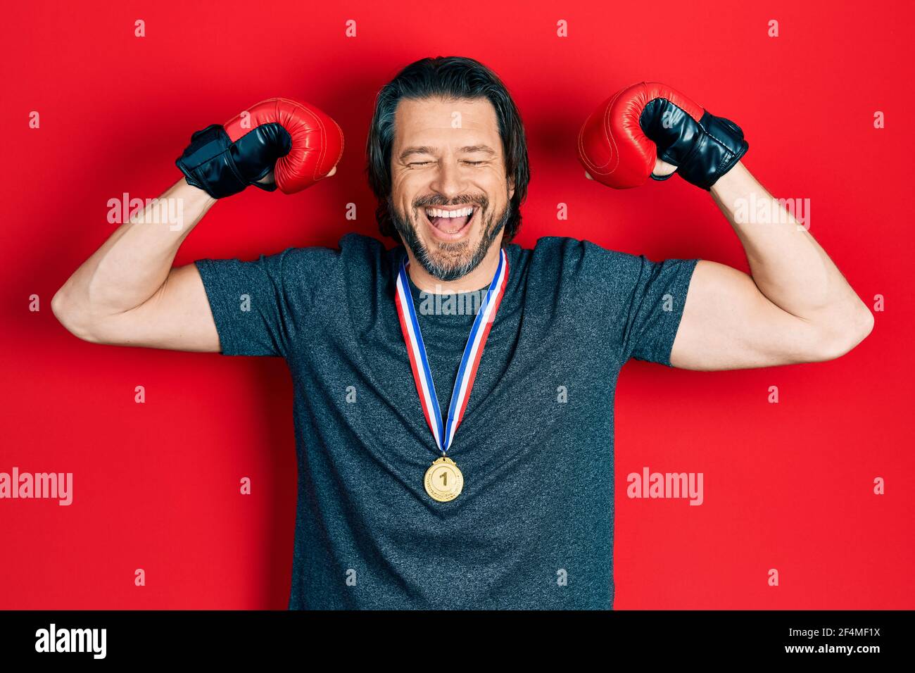 Middle age caucasian man wearing first place medal on boxing competition  smiling and laughing hard out loud because funny crazy joke Stock Photo -  Alamy