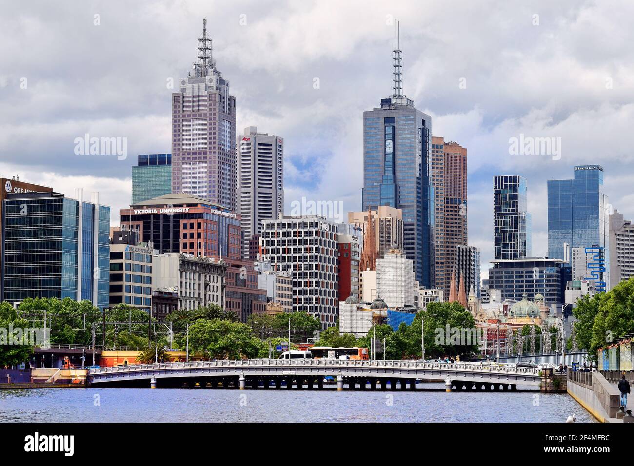 Melbourne, VIC, Australia - November 03, 2017: Different buildings, skyscrapers and Queens Bridge over Yarra river with Sandridge footbridge behind Stock Photo