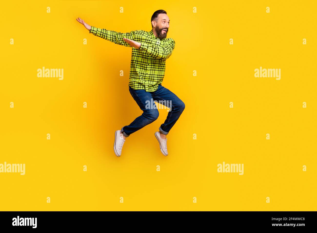 Full length photo of mature man happy positive smile jump up dance dab  hip-hop isolated over yellow color background Stock Photo - Alamy