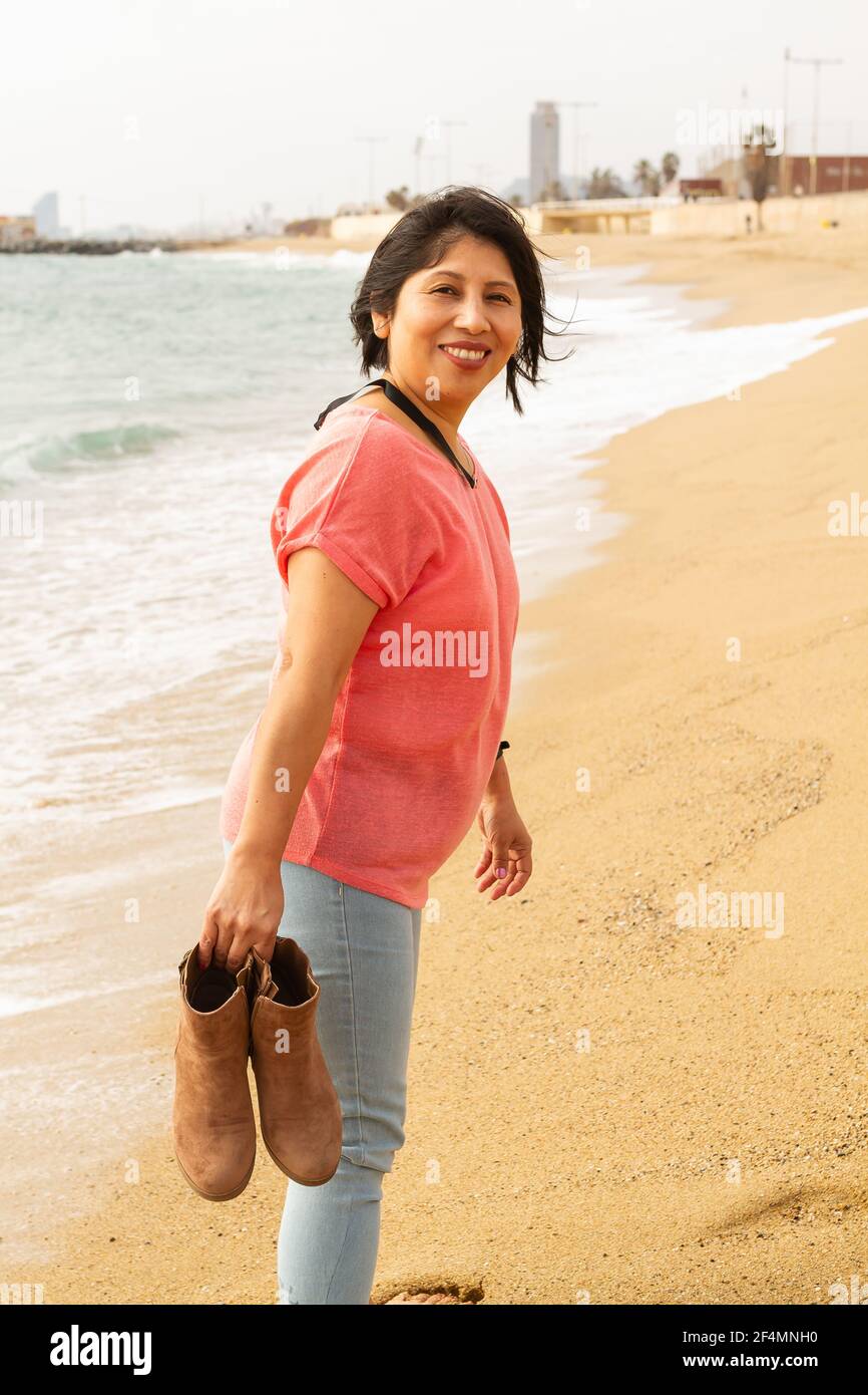 Young woman walking barefoot in hi-res stock photography and images - Alamy