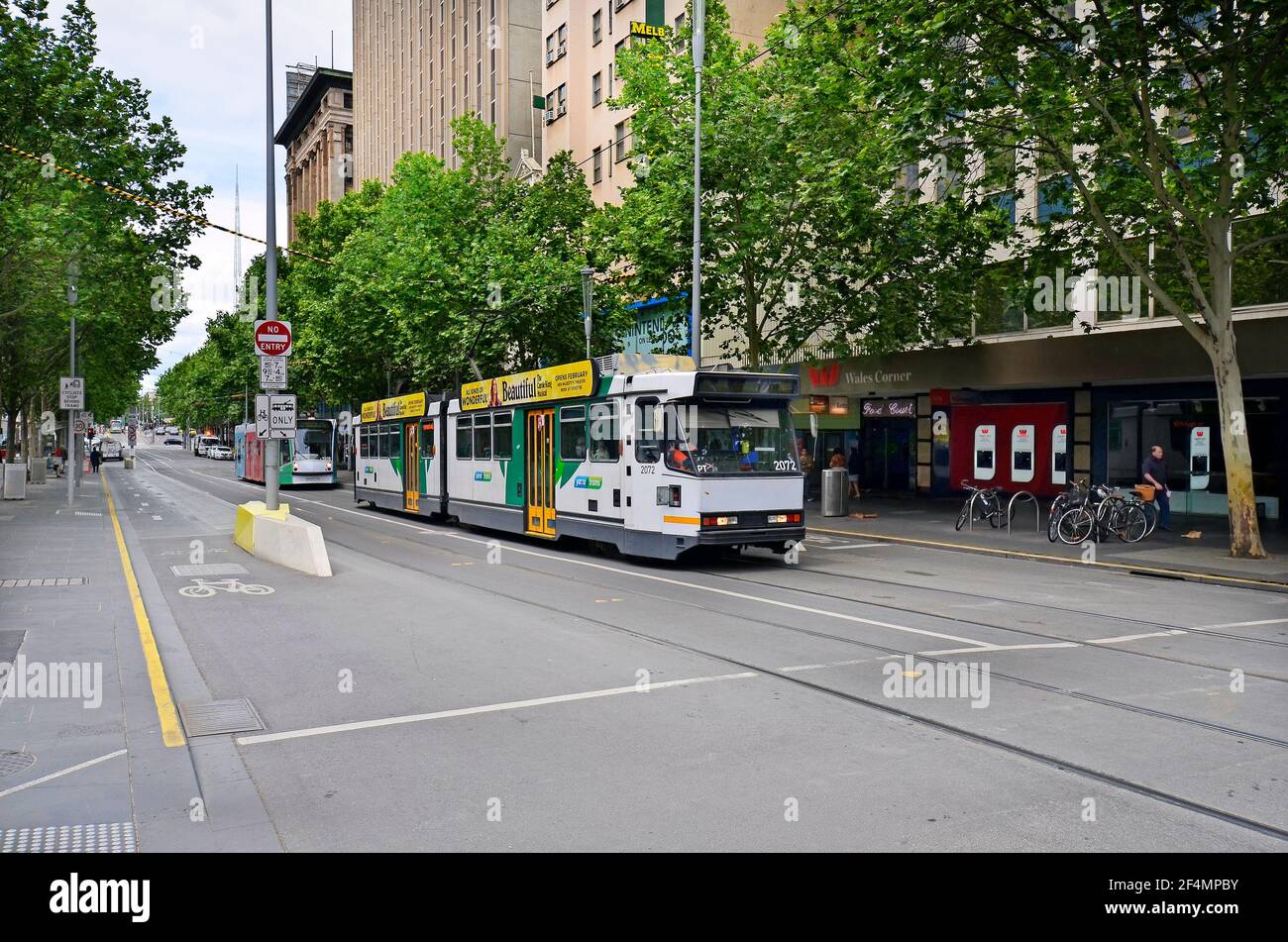 Melbourne, VIC, Australia - November 05, 2017: Unidentified people, shops and public tramway in Swanston Street Stock Photo