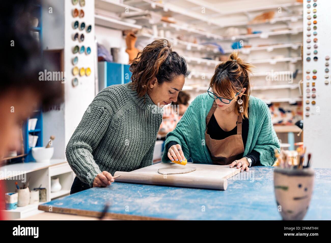 Focused artisan shaping pottery in hi-res stock photography and images ...