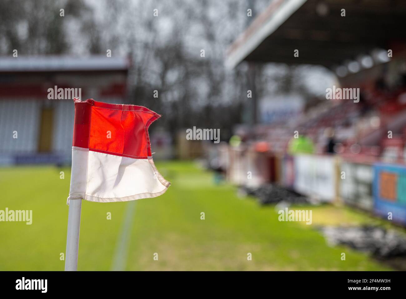 Close up of corner flag on football pitch at lower league stadium Stock