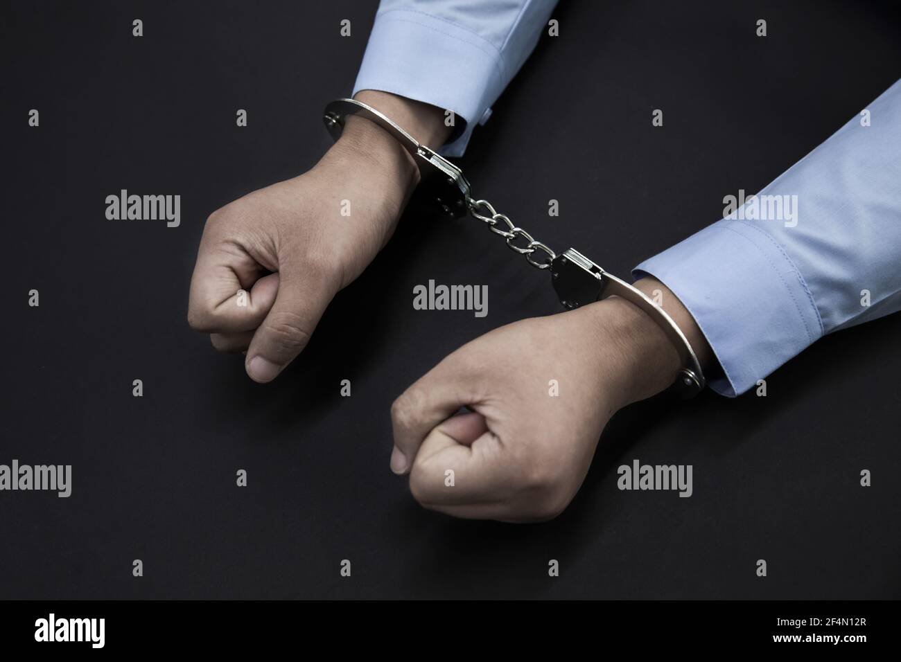 Handcuffs black man hi-res stock photography and images - Alamy