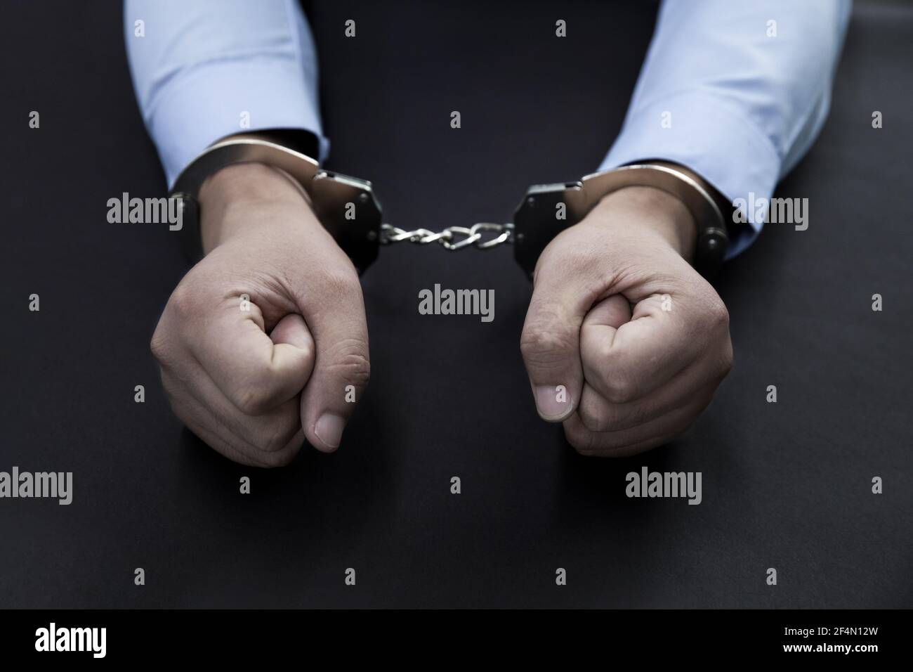 Handcuffs black man hi-res stock photography and images - Alamy