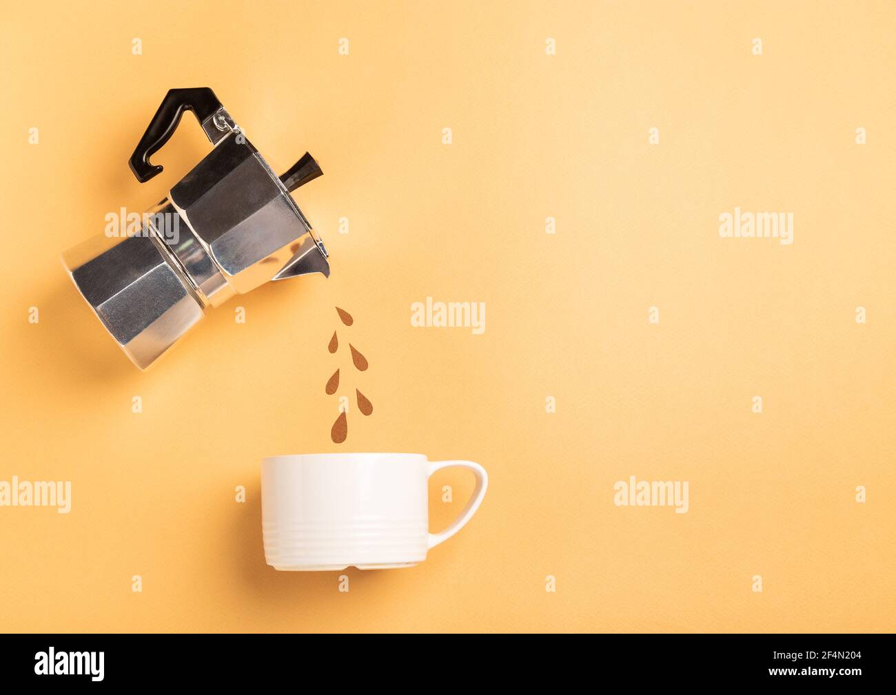 Paper cut drops pouring from a geyser coffee maker into a cup on yellow ...