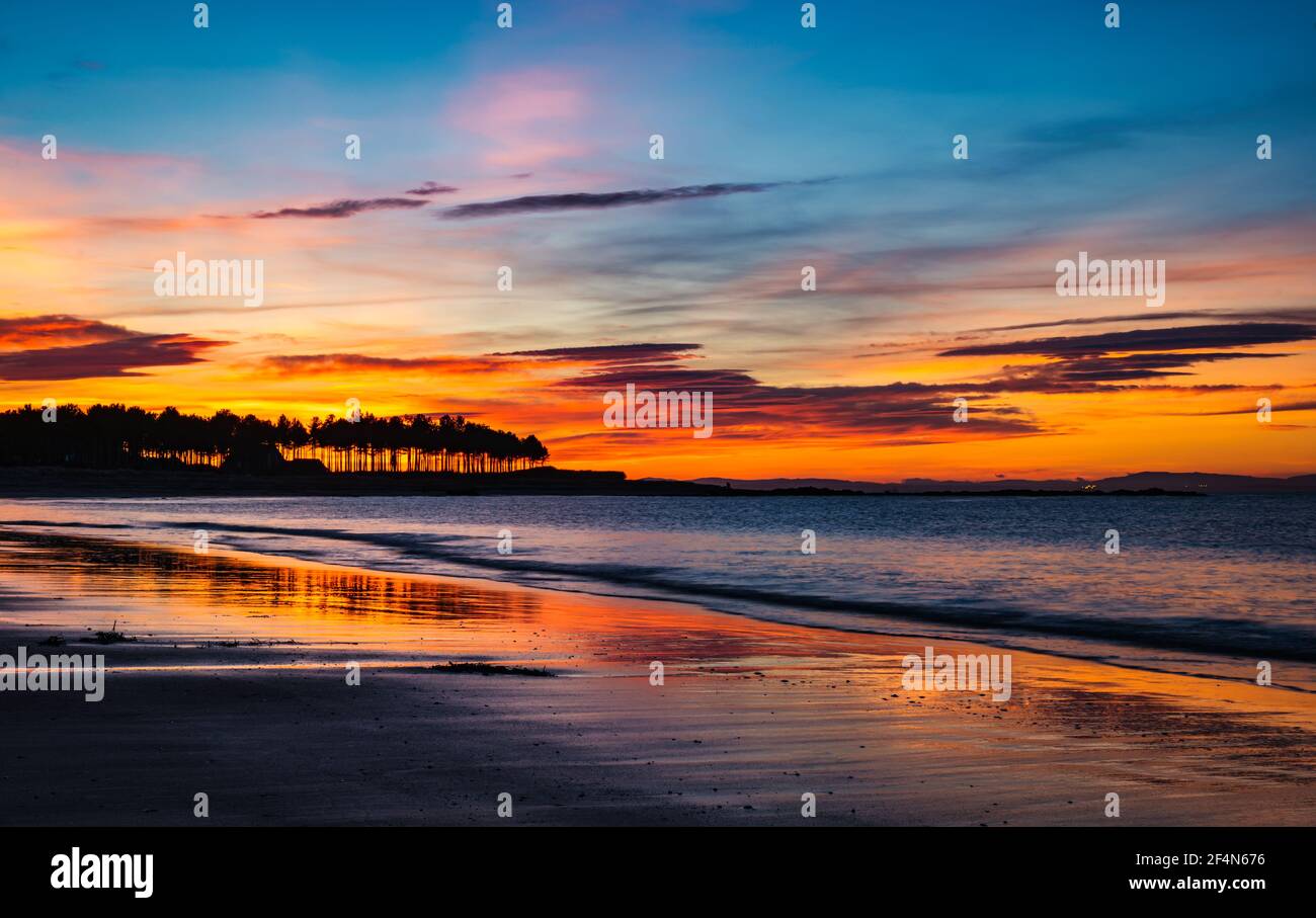 Colourful sunset at Yellowcraig beach, East Lothian, Scotland, UK Stock Photo