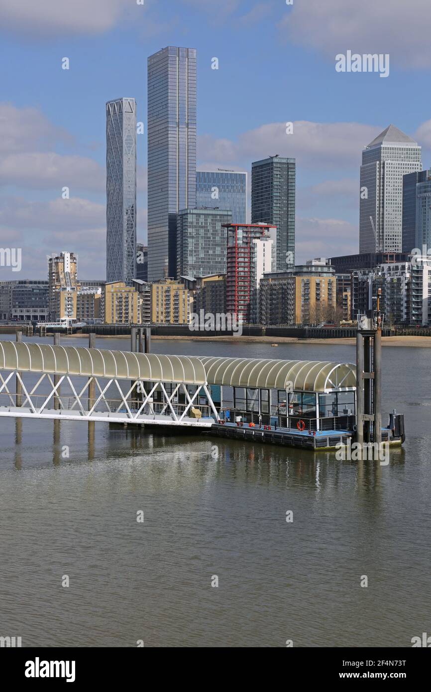 Canary Wharf, London, March 2021. View from Rotherhithe riverboat pier showing newly completed towers: Newfoundland and Landmark Pinnacle (left) Stock Photo