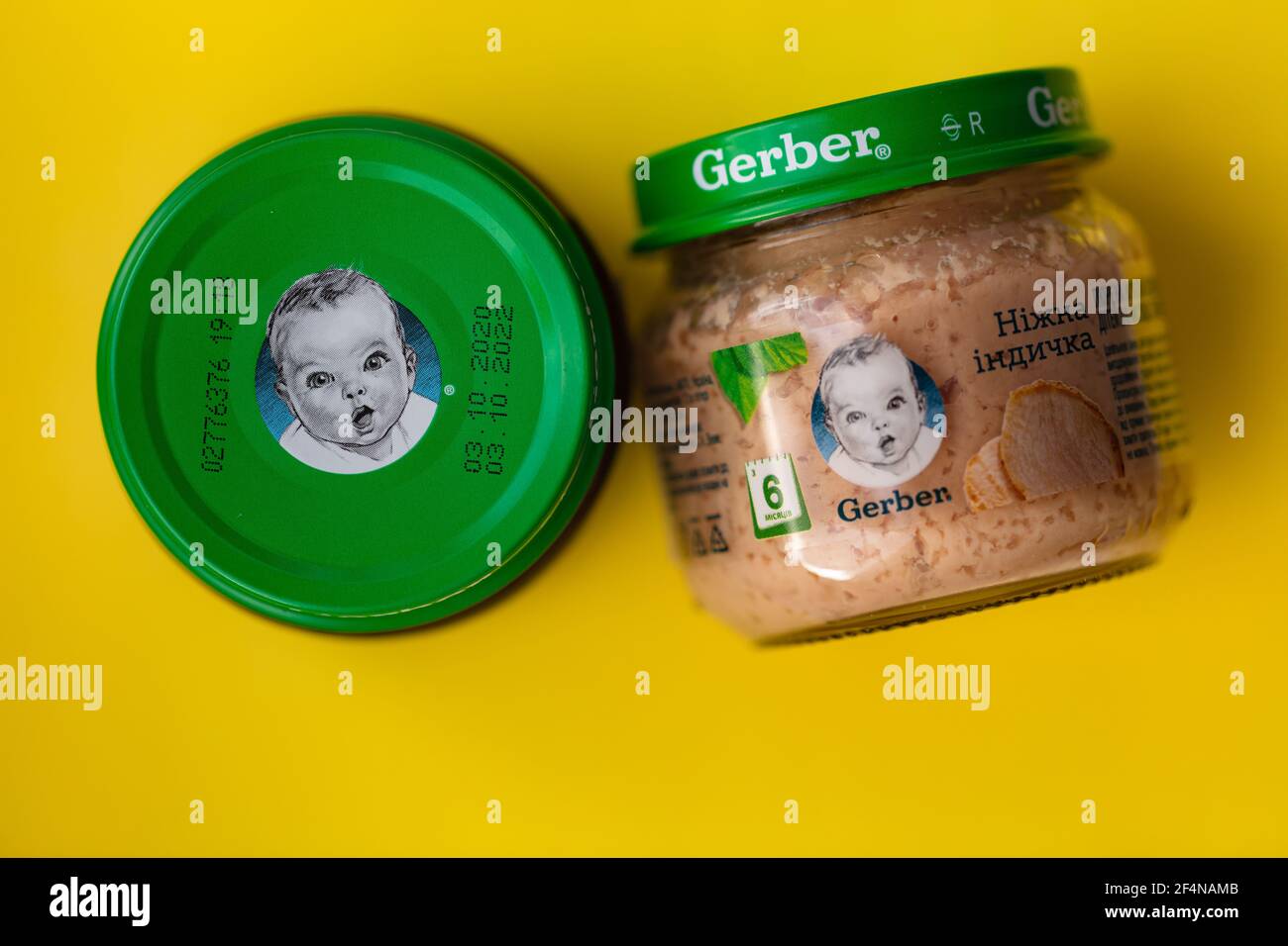 Lviv, Ukraine - March 22, 2020:  Gerber brand child nutrition turkey puree on yellow background Stock Photo