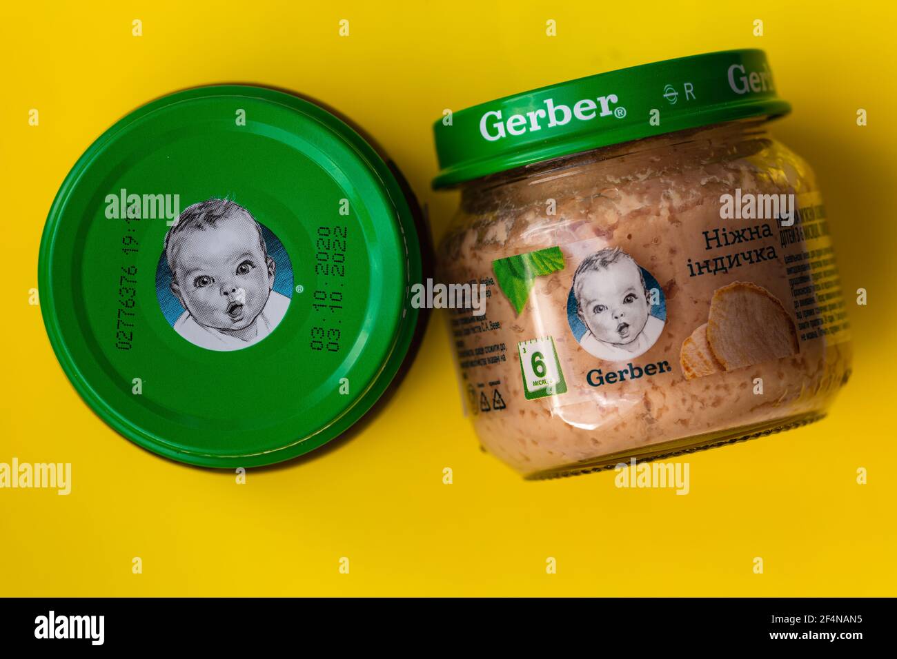 Lviv, Ukraine - March 22, 2020:  Gerber brand child nutrition turkey puree on yellow background Stock Photo