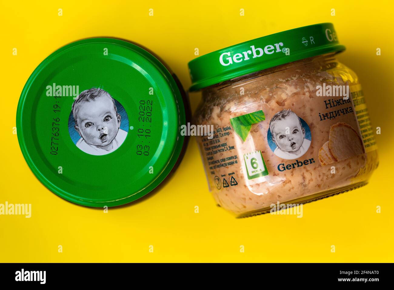 Lviv, Ukraine - March 22, 2020:  Gerber brand child nutrition turkey puree on yellow background Stock Photo