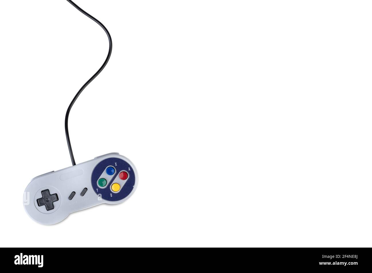 Vintage video game controller over white background with copy space ...