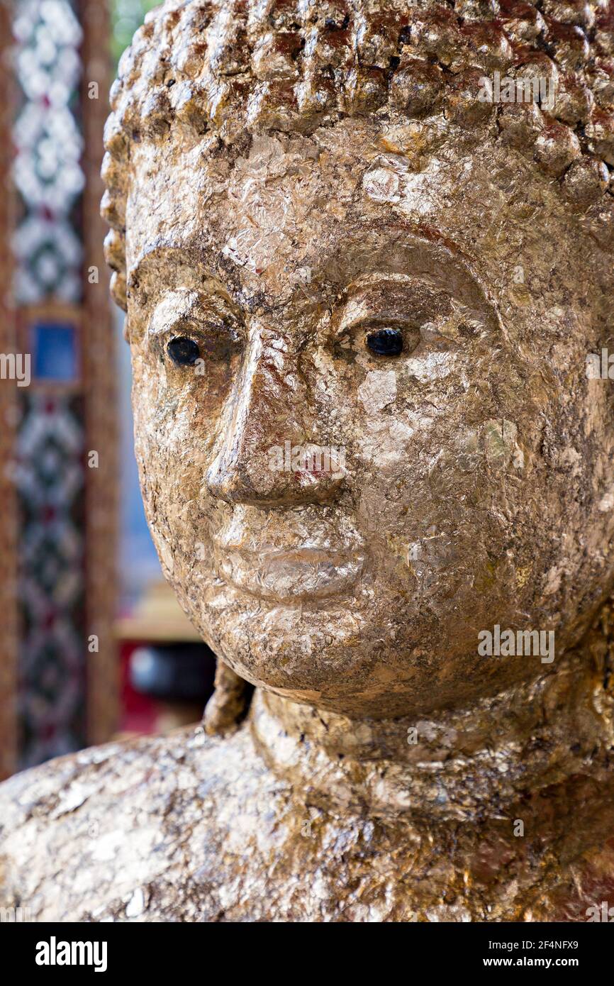 Face covered in gold leaf, Luang Poh Dang at Wat Prok Charoen, Bangkok, Thailand Stock Photo
