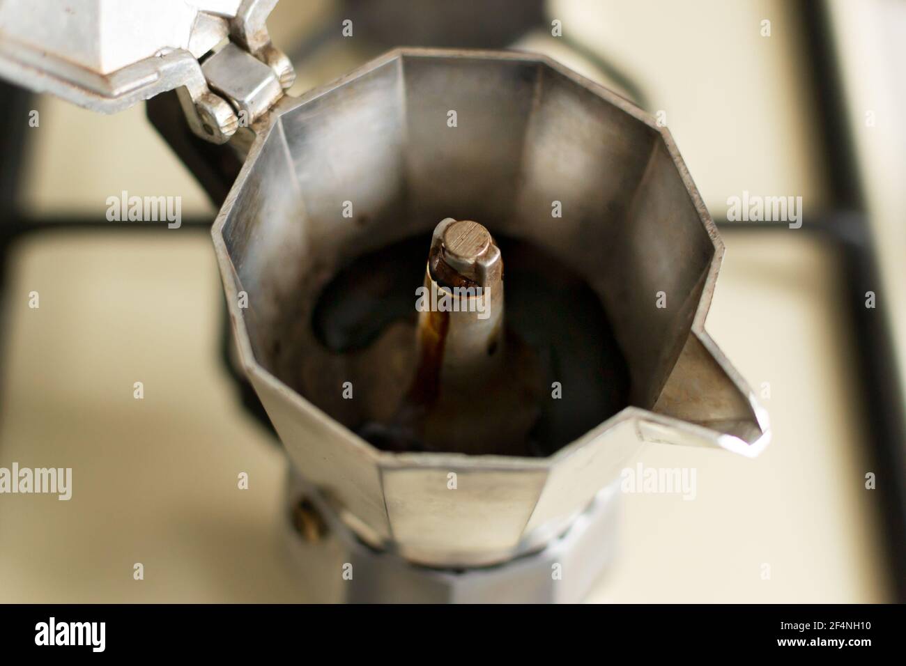 Making coffee at home in a geyser coffee maker. Closeup. Selective