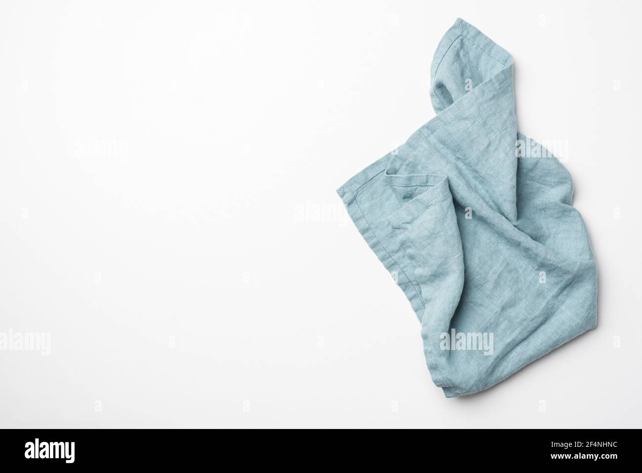 Teal kitchen textile folded isolated on white background Stock Photo