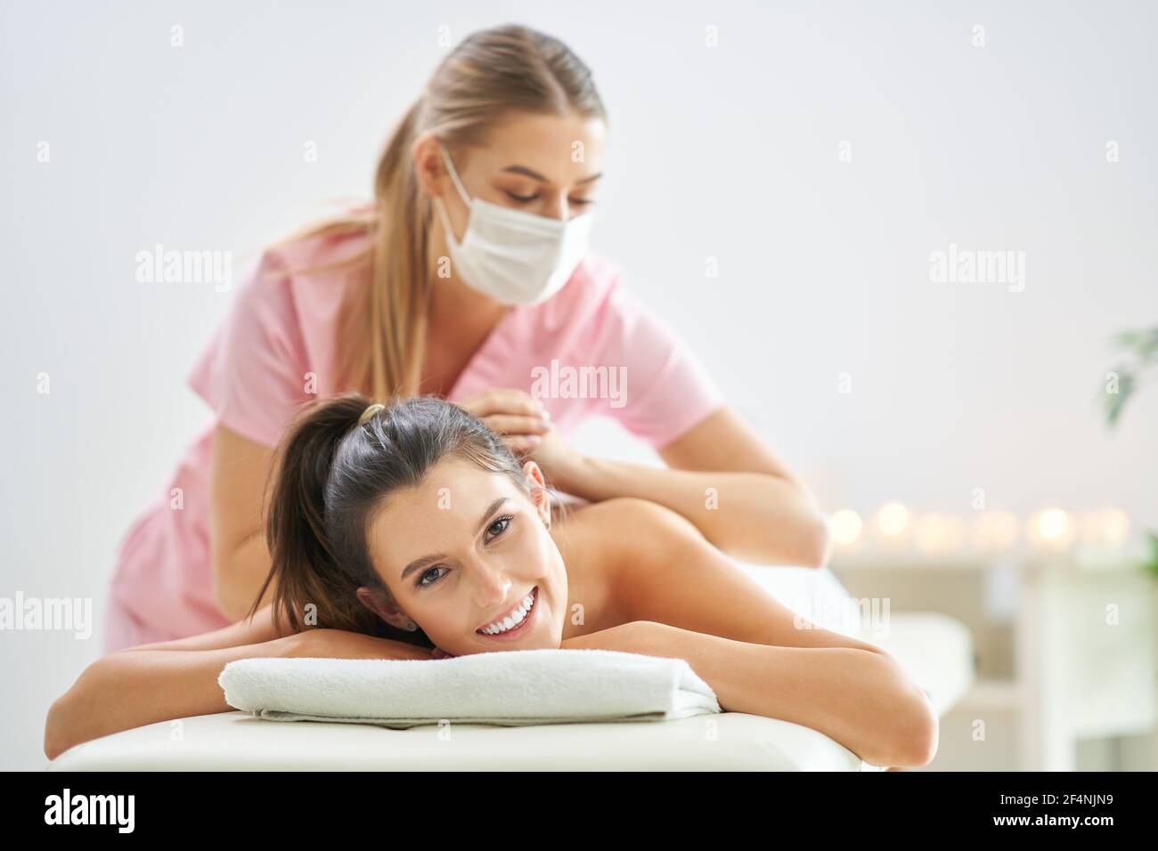 Middle-aged woman having a back massage in a beauty salon. 4675724