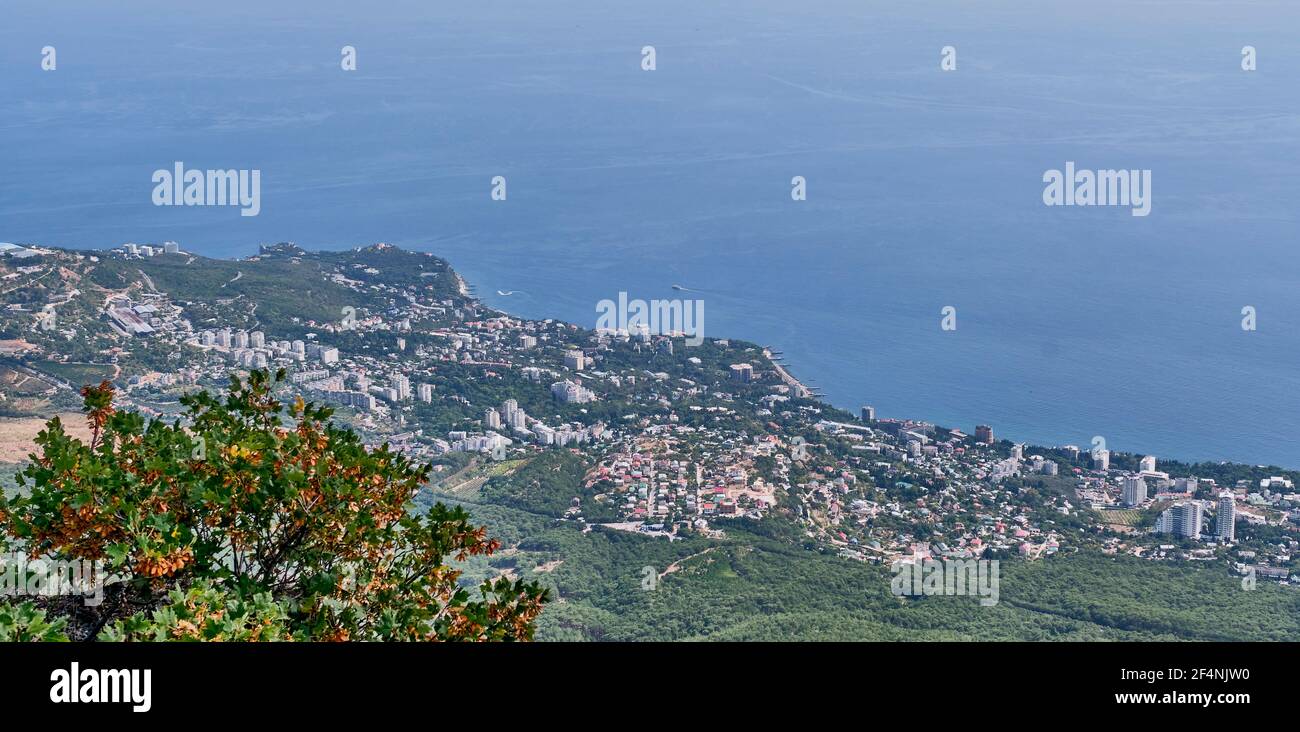 Cityscape . View of Greater Yalta and the Black Sea coast from the Ai Petri plateau, Crimea. Stock Photo