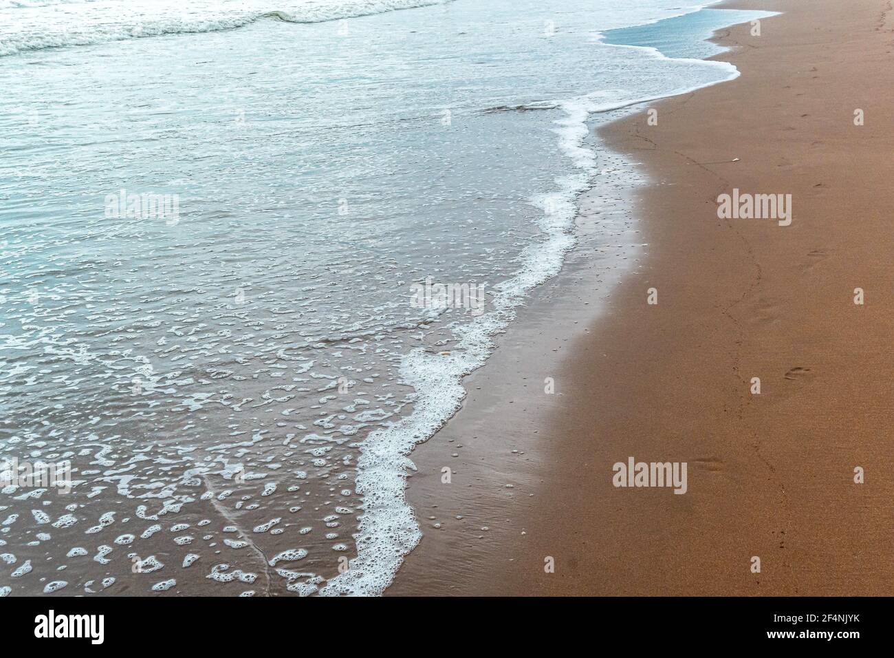 Beautiful view of splashing sea waves on the beach Stock Photo - Alamy