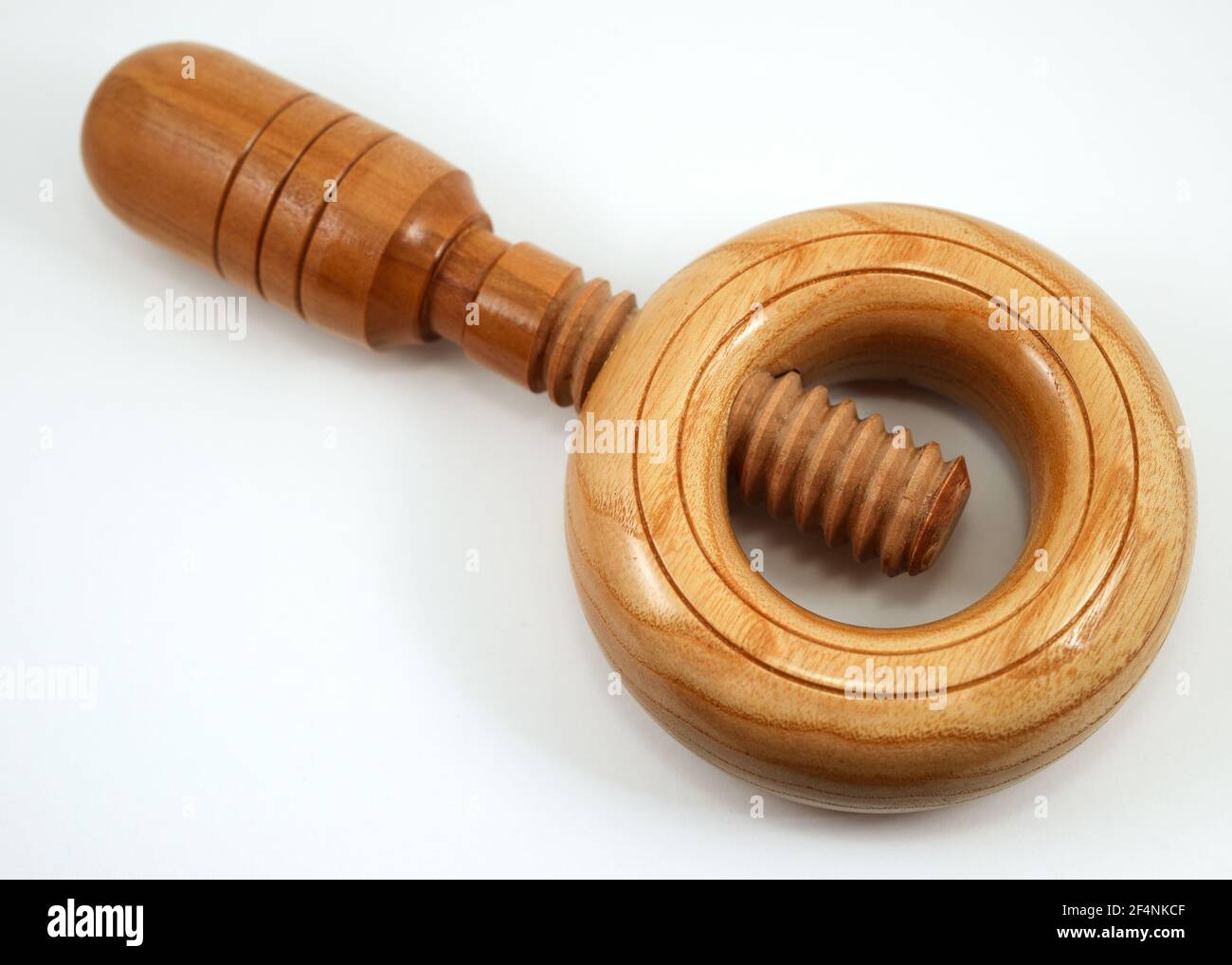 traditional handheld wooden nutcracker on a white background Stock Photo