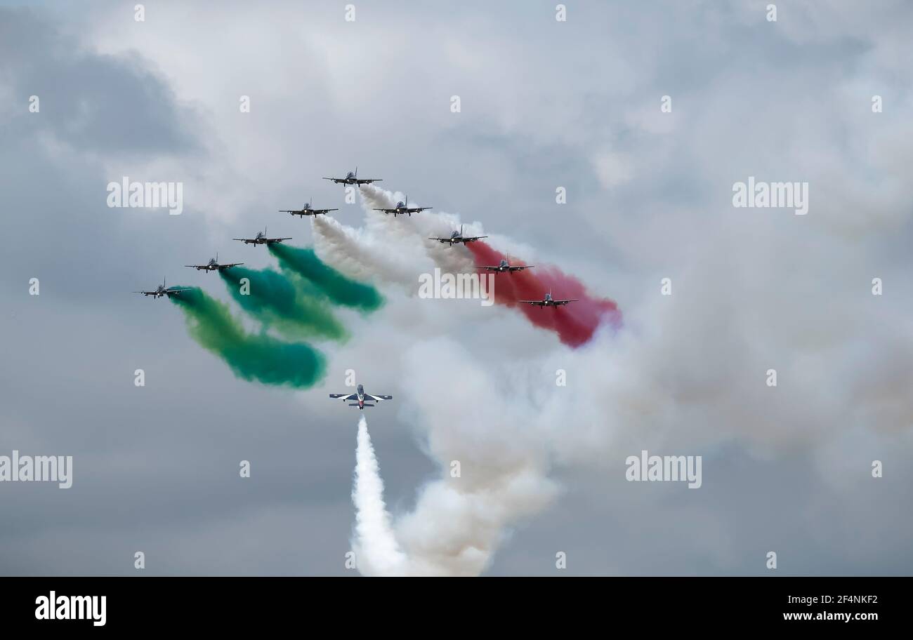 Italian Air Force Frecce Tricolori Aerobatic Team in sky with red