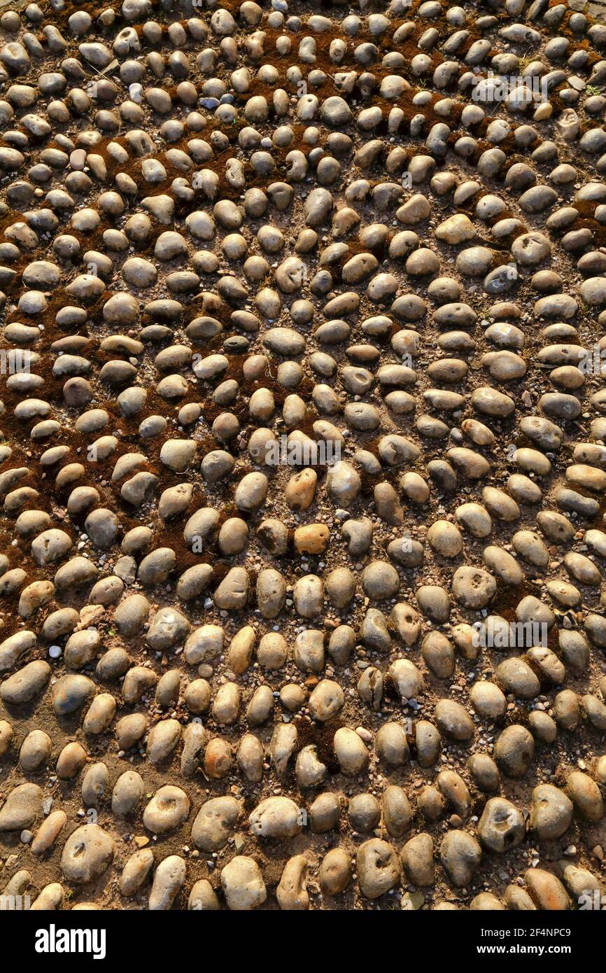Pebble mosaic in circular shape as abstract background Stock Photo