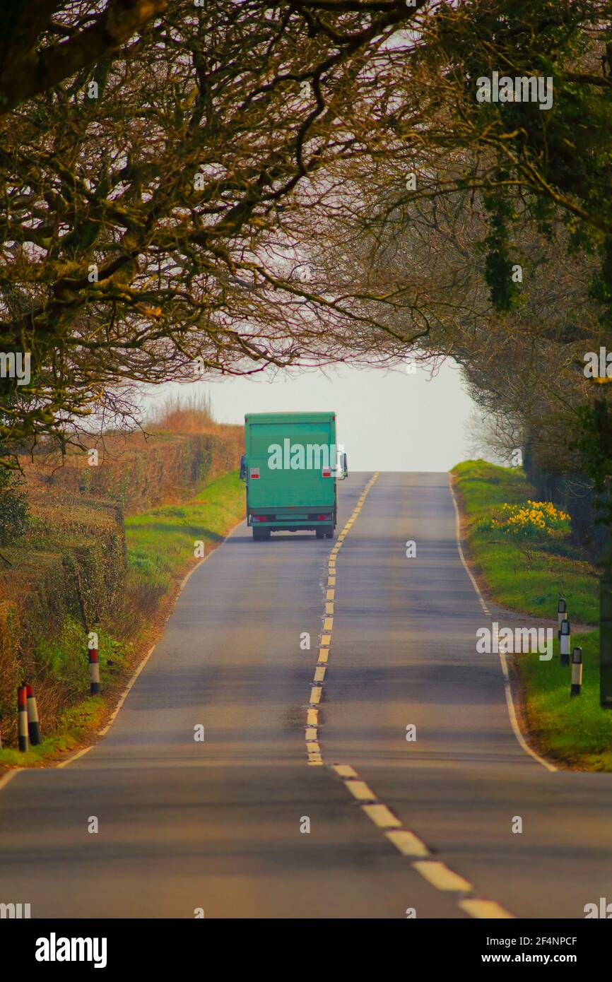 Green truck on the road Stock Photo