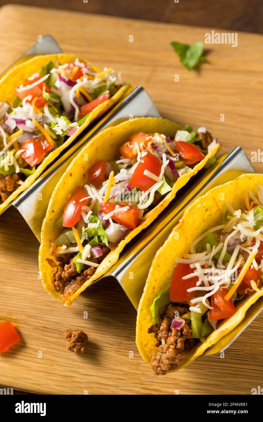 Homemade Ground Beef Hard Shell Tacos with Lettuce and Tomato Stock