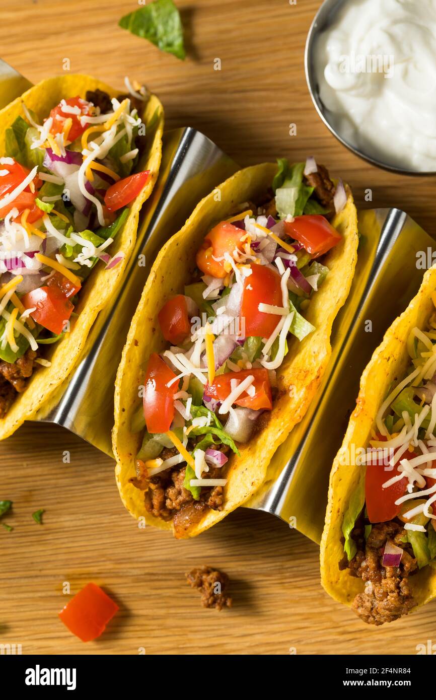 Homemade Ground Beef Hard Shell Tacos with Lettuce and Tomato Stock