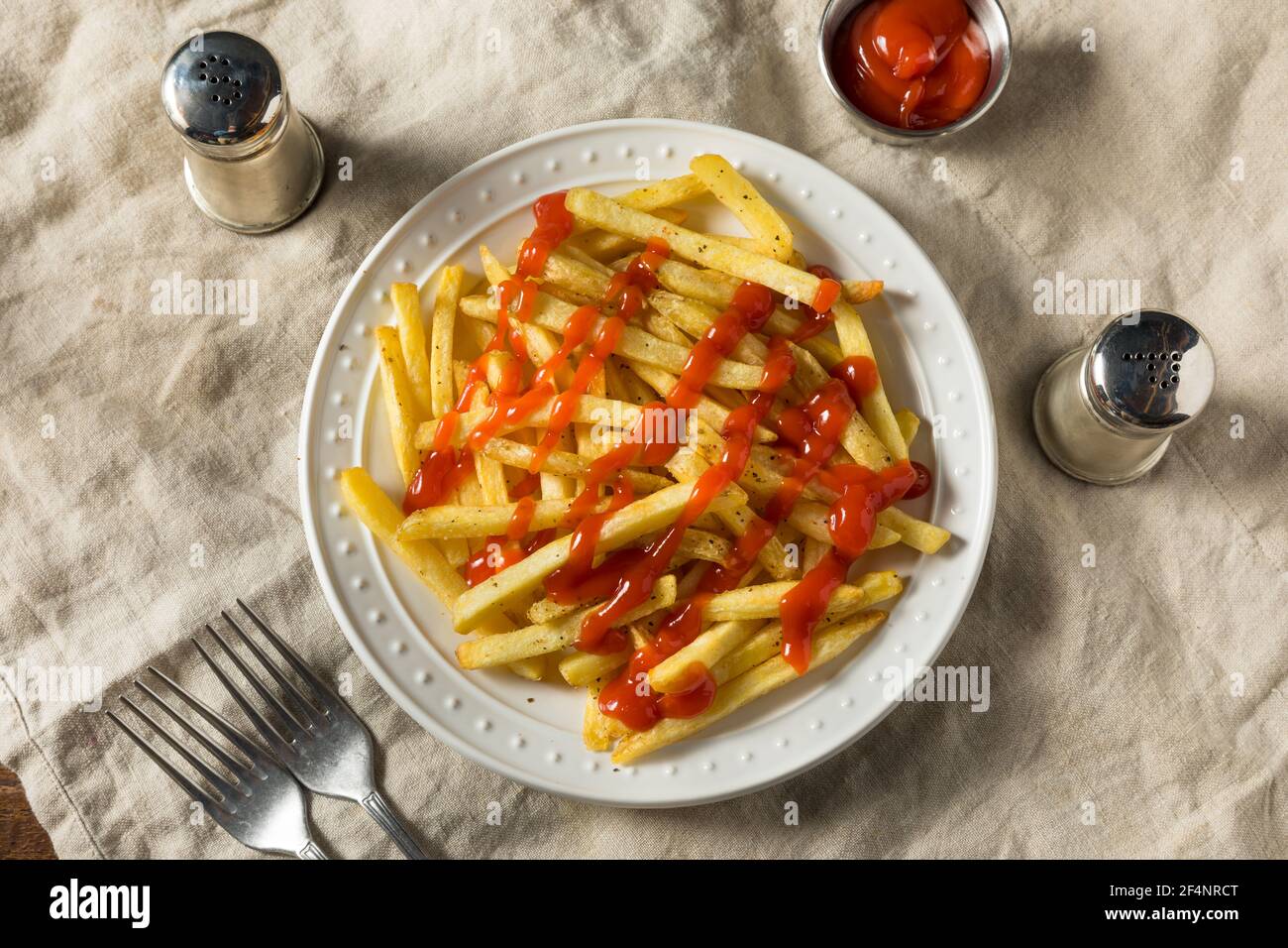 Homemade French Fries with Ketchup with Salt and Pepper Stock Photo Alamy