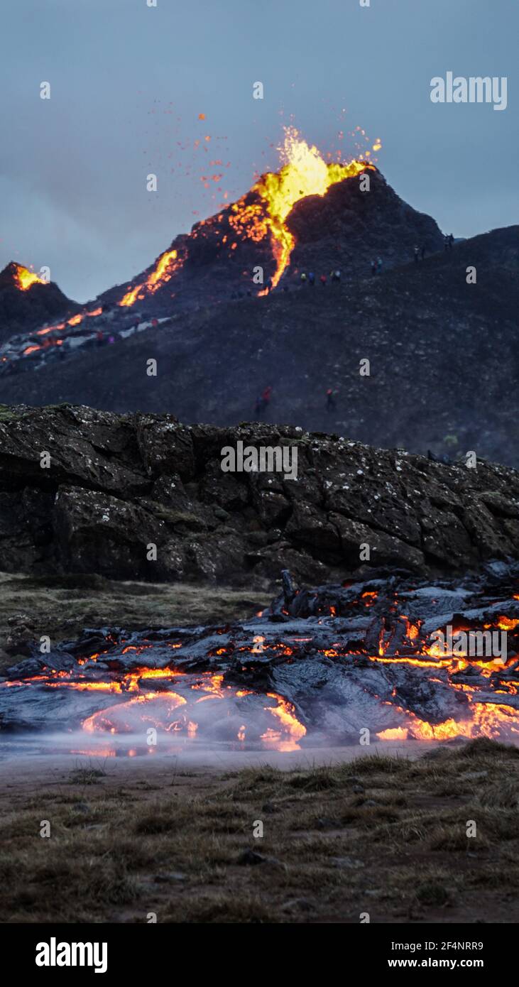 Molten lava flowing from a small volcanic eruption in Mt Fagradalsfjall, near the capital of Reykjavik, Southwest Iceland, in March 2021. Stock Photo