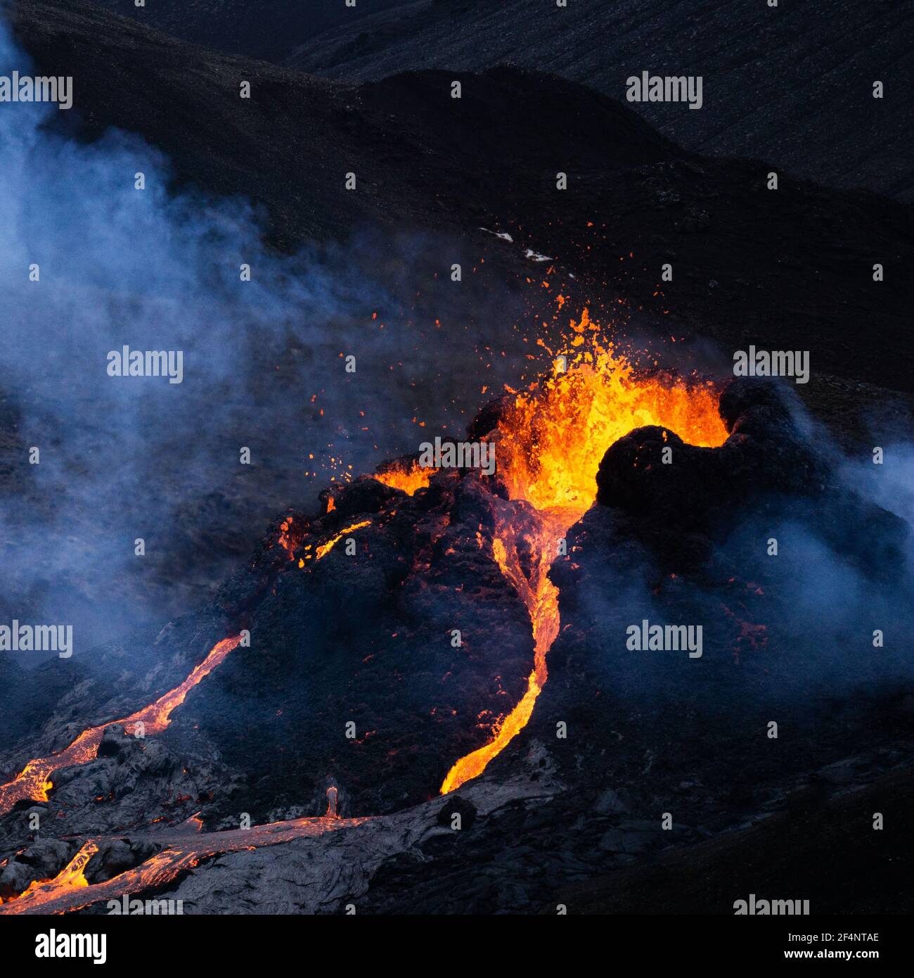 Molten lava flowing from a small volcanic eruption in Mt Fagradalsfjall, near the capital of Reykjavik, Southwest Iceland, in March 2021. Stock Photo