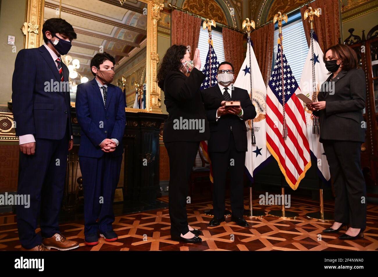Isabel Guzman, administrator of the U.S. Small Business Administration (SBA), is joined by her husband, Javier Guzman, and sons, Cortez Guzman and Cruz Guzman as she is sworn in by U.S. Vice President Kamala Harris during a ceremony in the Eisenhower Executive Office Building in Washington, DC, U.S., on Monday, March 22, 2021. Guzman served as a deputy chief of staff and senior adviser to the administrator at the SBA during the Obama administration, and has run her own small businesses. Credit: Erin Scott/Pool via CNP /MediaPunch Stock Photo