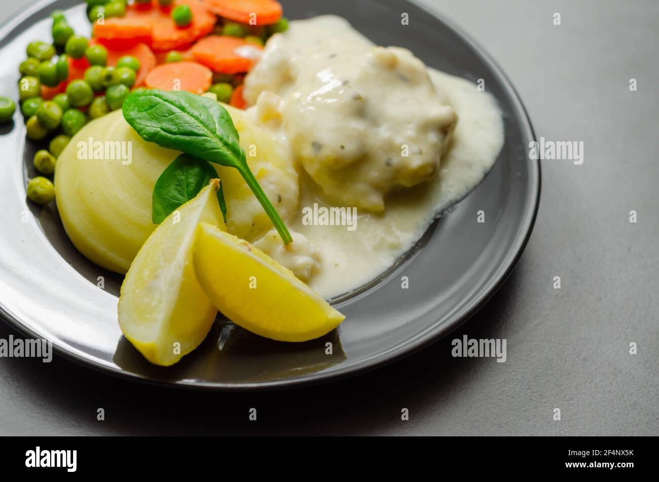 Cod Mornay, flaky cod with a creamy cheese sauce, with mashed potato