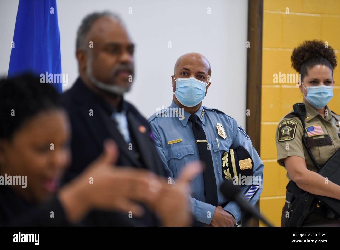 Minneapolis Police Chief Medaria Arradondo listens while John Harrington,  Minnesota Department of Public Safety Commissioner, briefs the press, as  jury selection continues in the trial of a former police officer Derek  Chauvin,