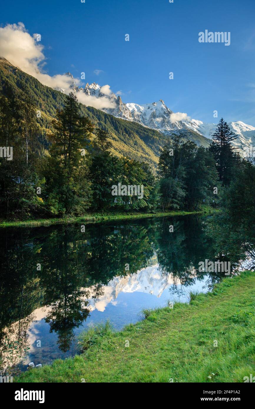 French Alps reflecting in still waters of the Arve River in the