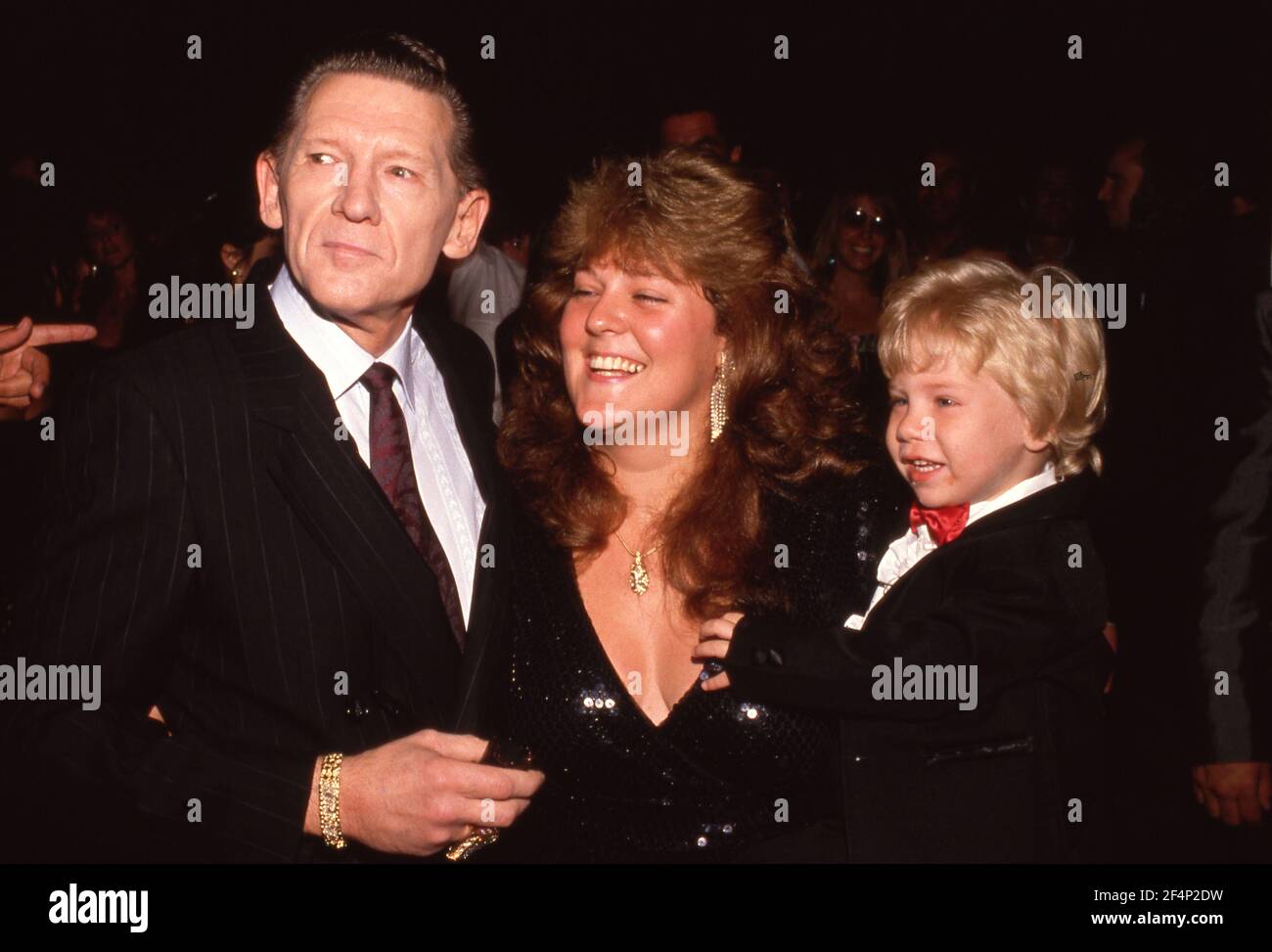 Jerry Lee Lewis and wife Kerrie w. their son at party for film Great Balls of Fire June 26, 1989  Credit: Ralph Dominguez/MediaPunch Stock Photo