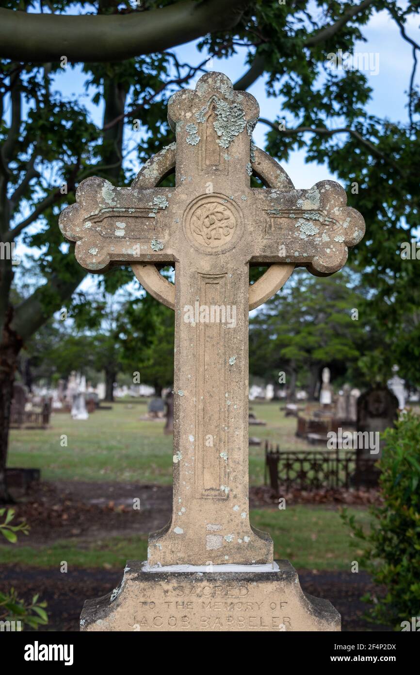 Carved stone cross on grave Stock Photo