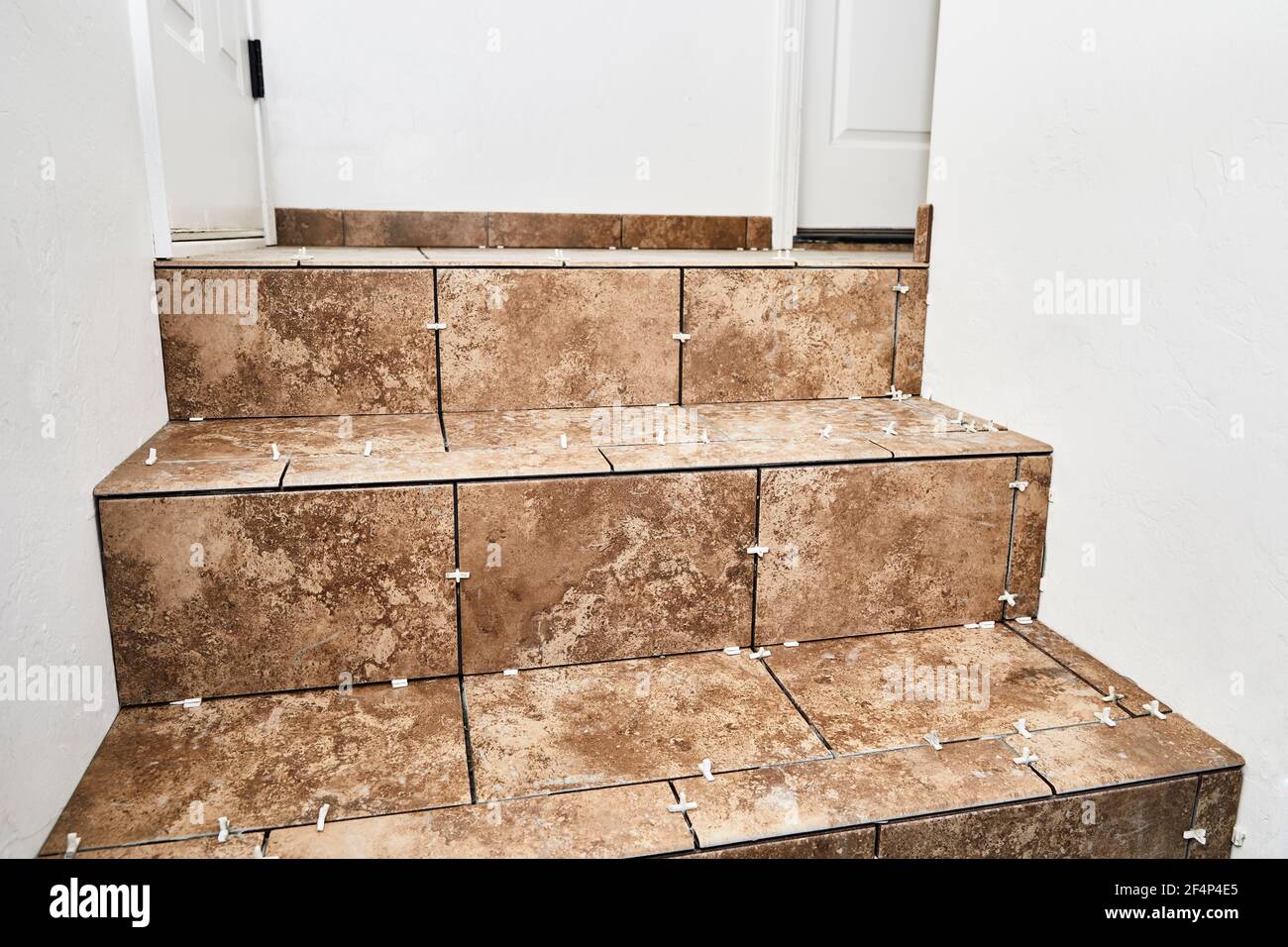 New tile installation on steps with a landing in preparation to be