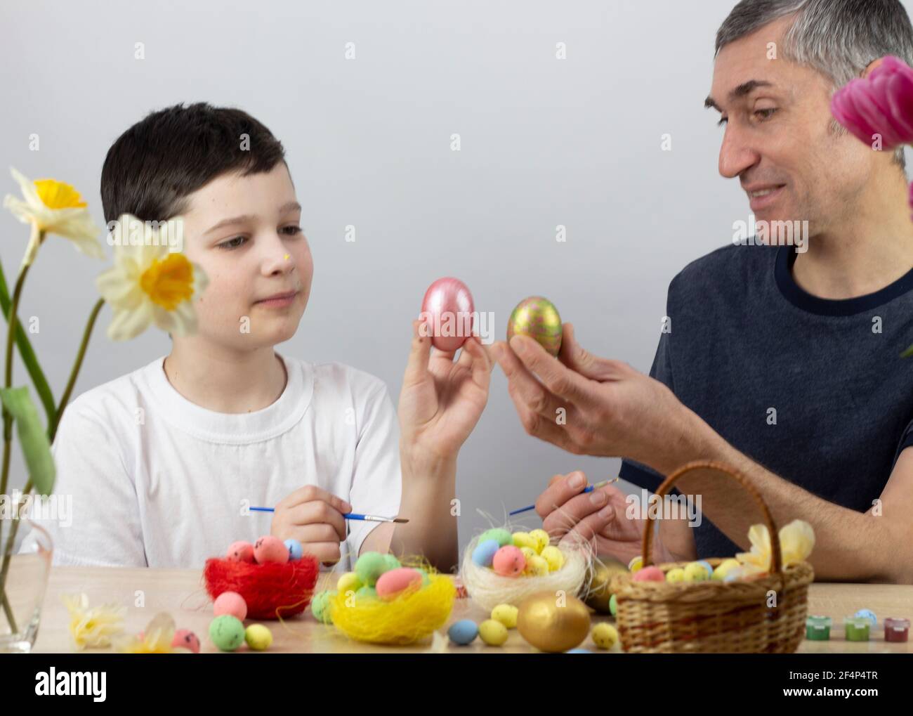 Easter eggs. Happy Easter card. Multi-colored Easter eggs. Easter. Easter eggs on a white wooden background. Place for text Stock Photo