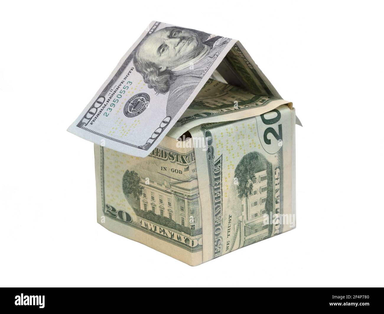 Denominations of USA dollar bills are arranged to represent a small house, demonstrating concepts such as home ownership, work, and personal finances. Stock Photo