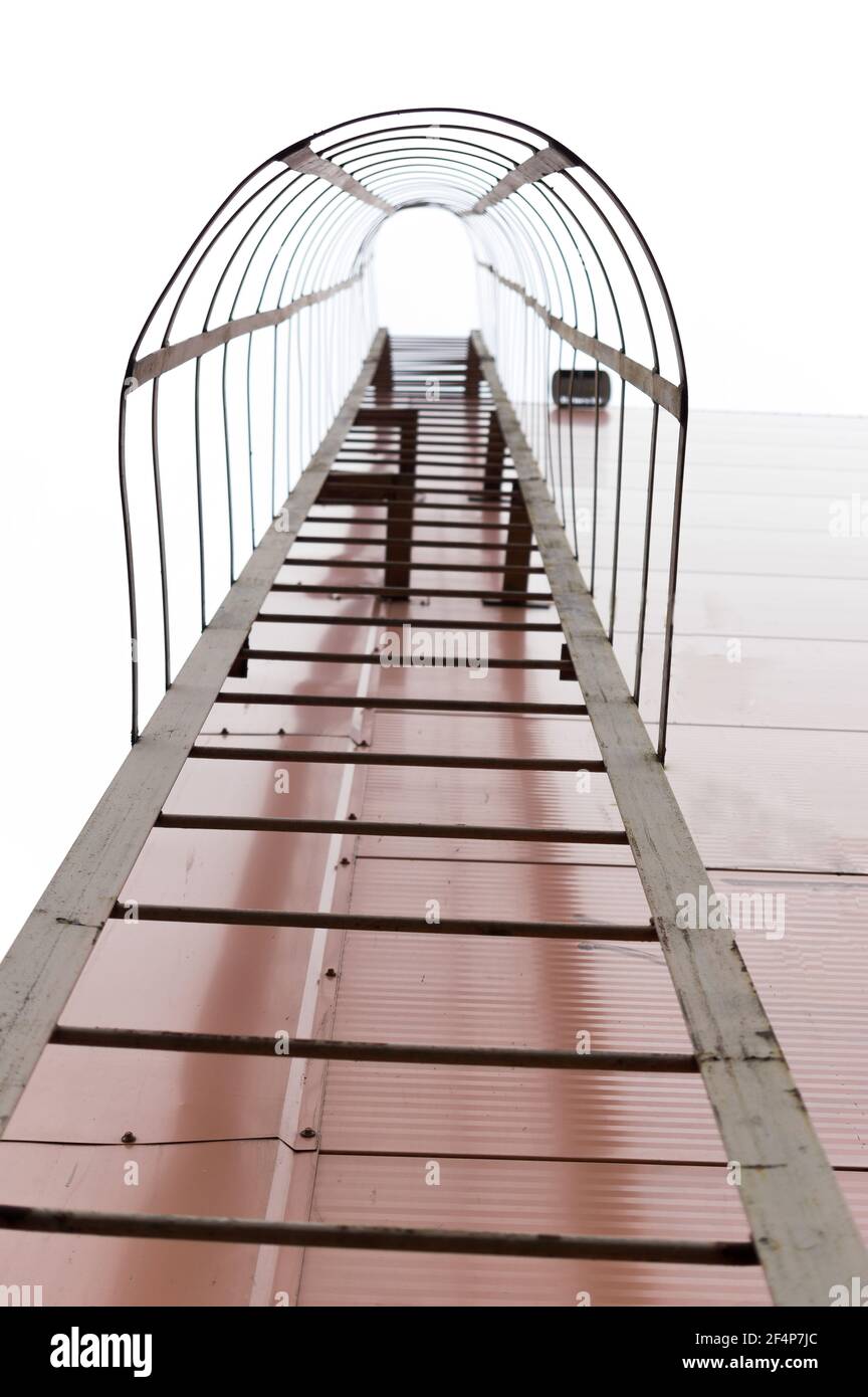 Fire escape with a tunnel. Roof ladder with tunnel. Safety ladder
