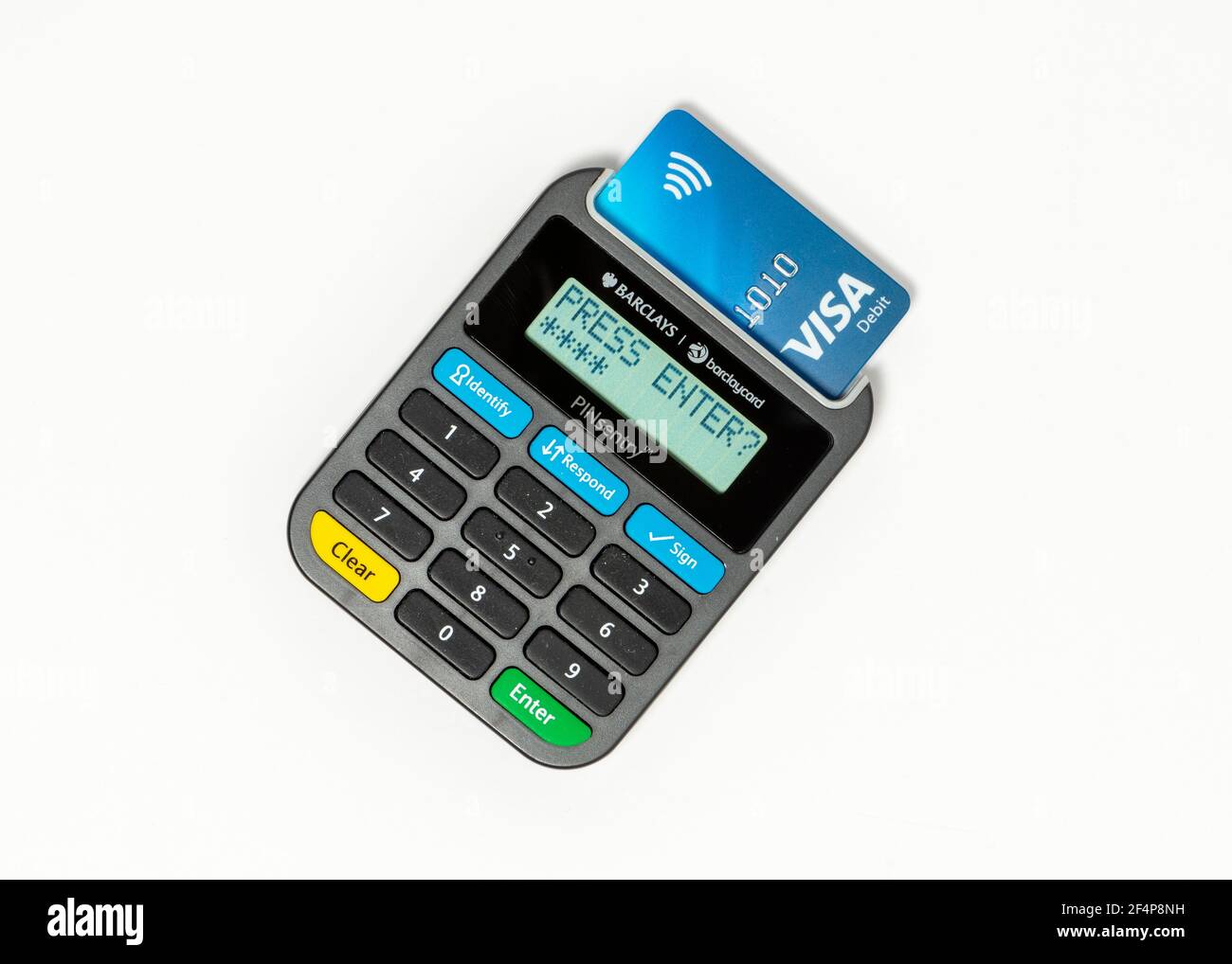 Press enter text on a Barclays Pinsentry card reader device display and a Visa Debit card Stock Photo