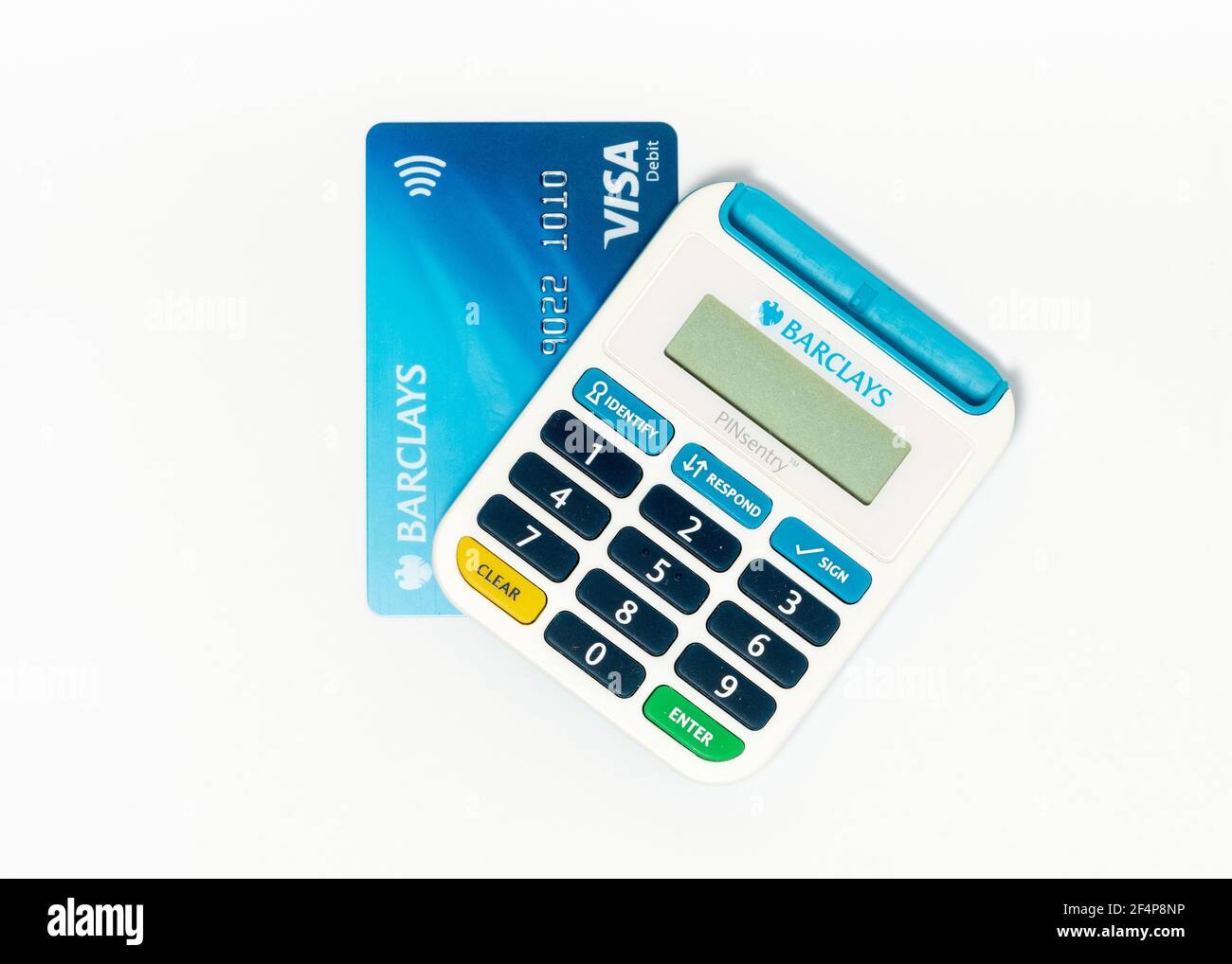 Barclays Pinsentry card reader device and a Visa Debit card on white Stock Photo