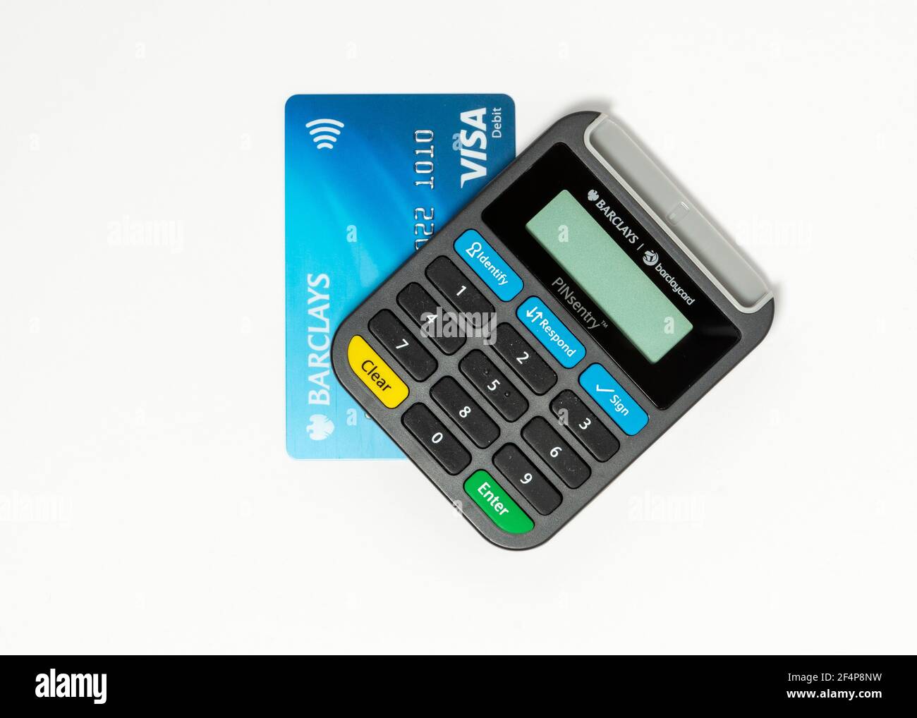 Barclays Pinsentry card reader device and a Visa debit card on white Stock Photo