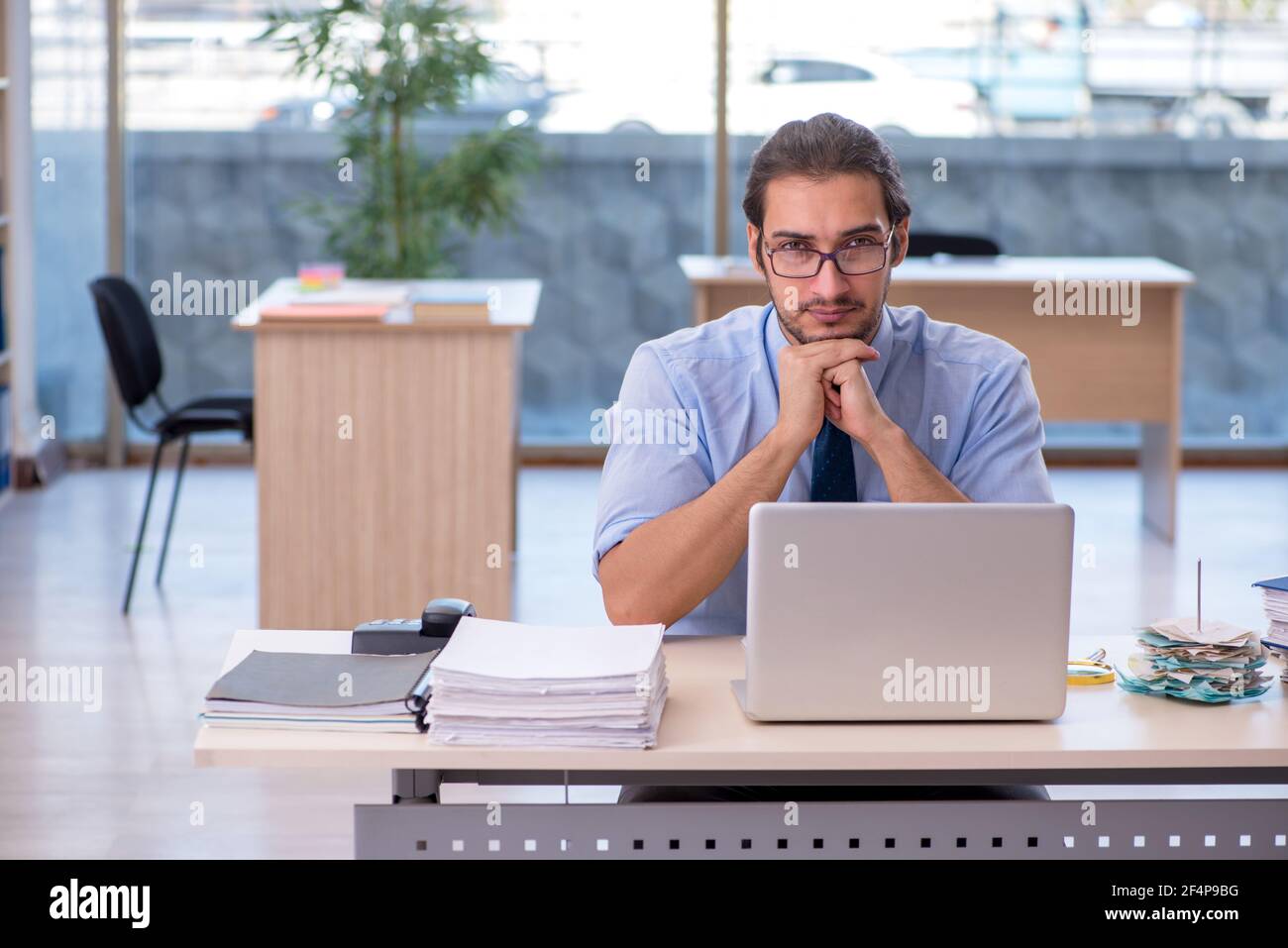Young accountant working in the office Stock Photo - Alamy