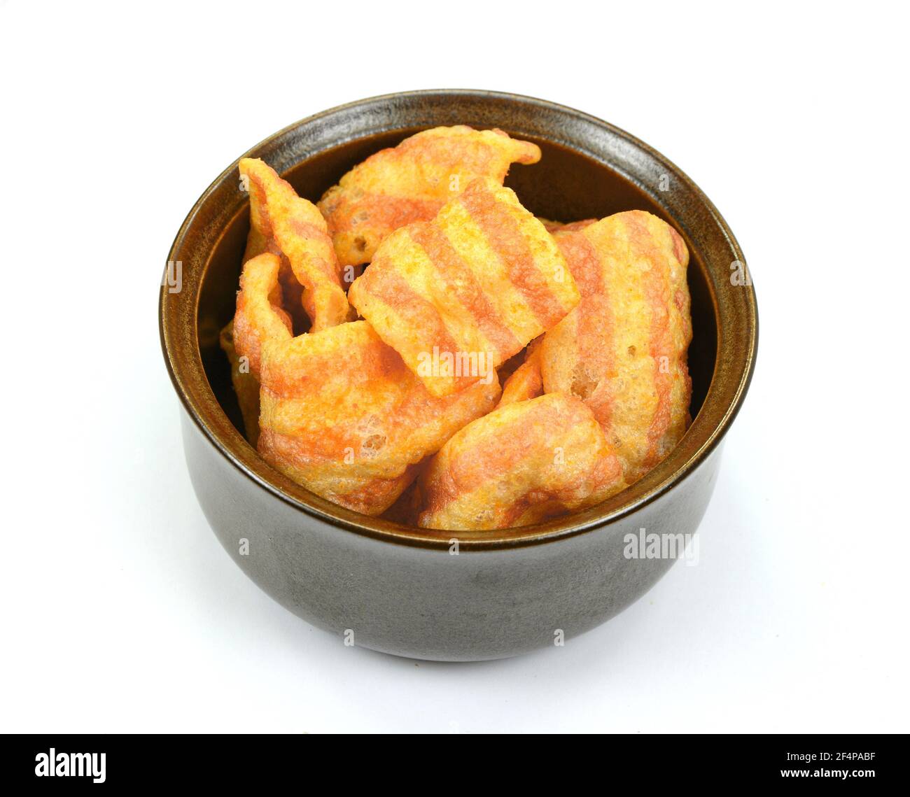 Bowl of baconflavored puffed wheat chips. Bacon Chips. Delicious bacon