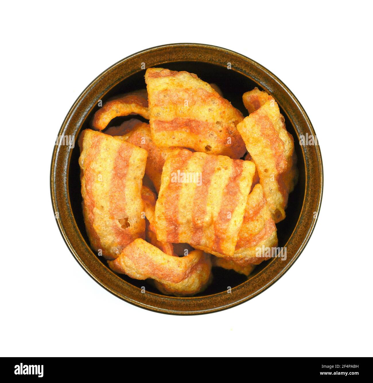 Bowl of baconflavored puffed wheat chips. Bacon Chips. Delicious bacon