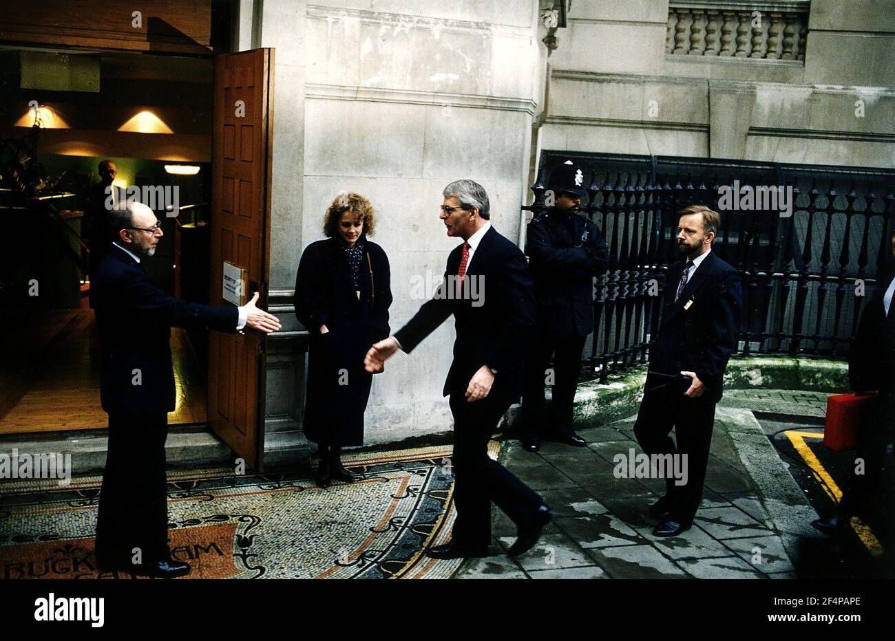 John Major MP the British Prime Minister arriving at the Scott Inquiry to give evidence being welcomed by David Price one of the inquiry team Dbase Stock Photo